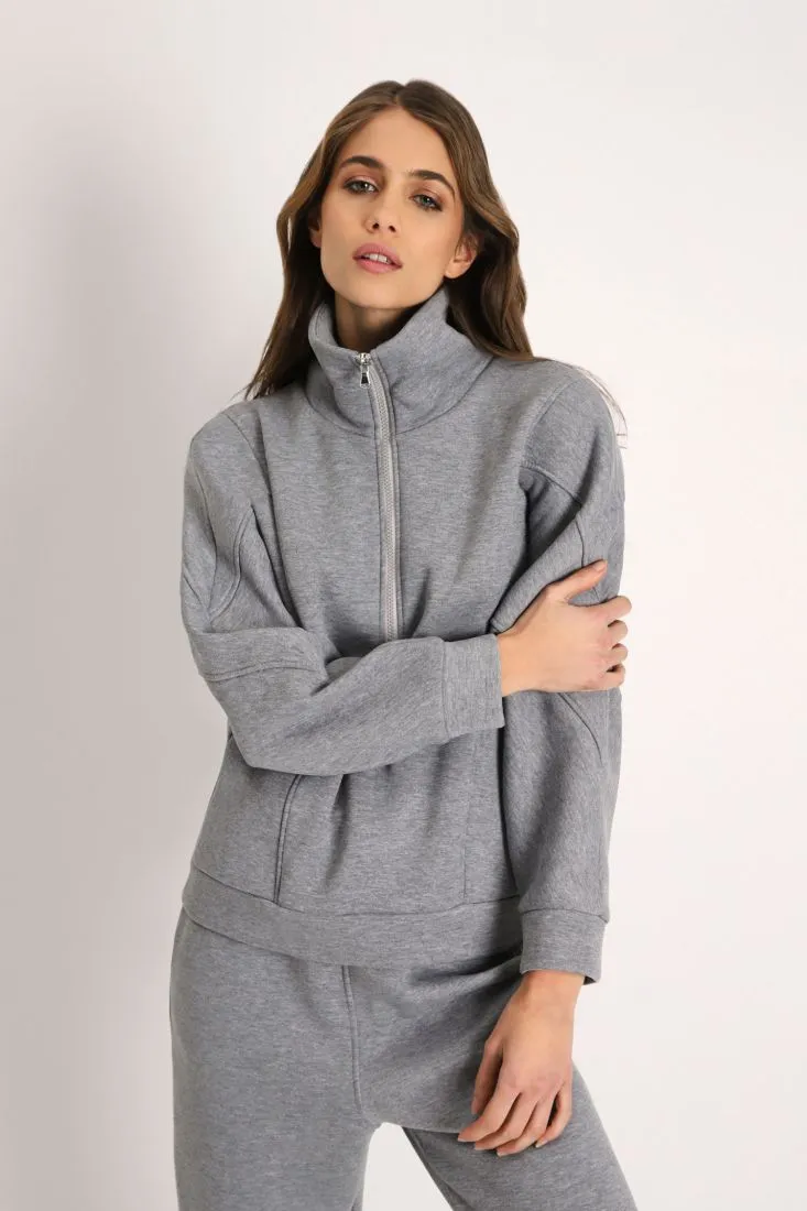 Felpa oversize monocolour con collo alto e zip