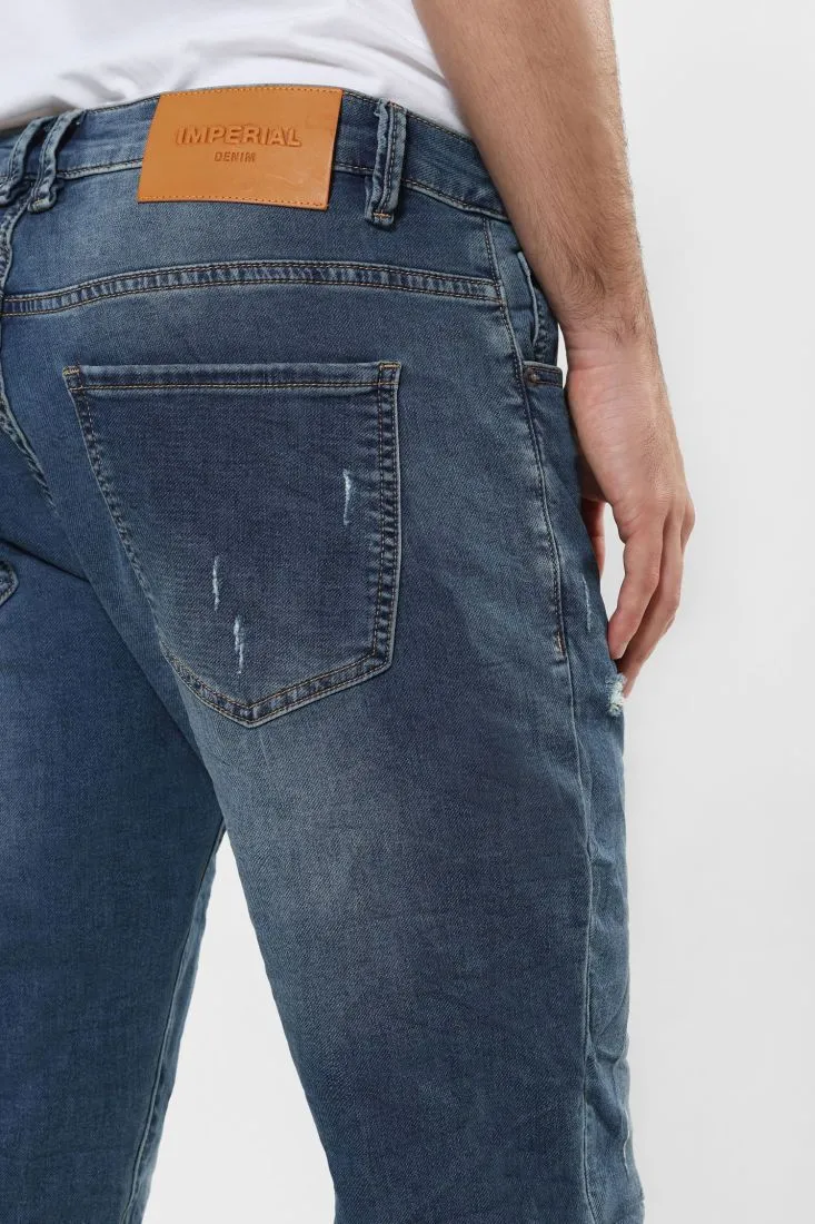 Jeans slim-fit effetto délavé con abrasioni