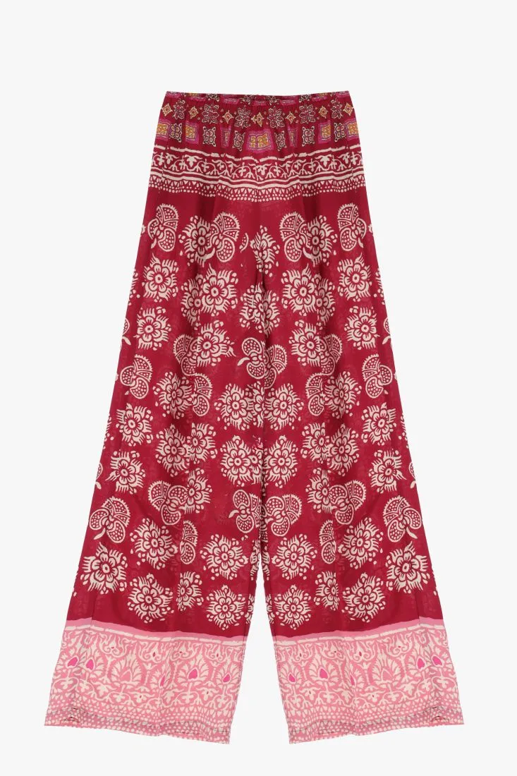 Pantaloni a palazzo floreali con orli inferiori a contrasto
