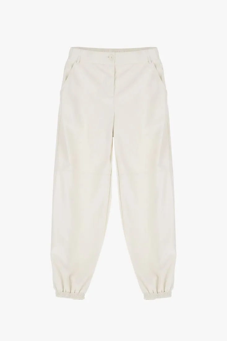 Pantaloni baggy in similpelle monocolour con tasche americane