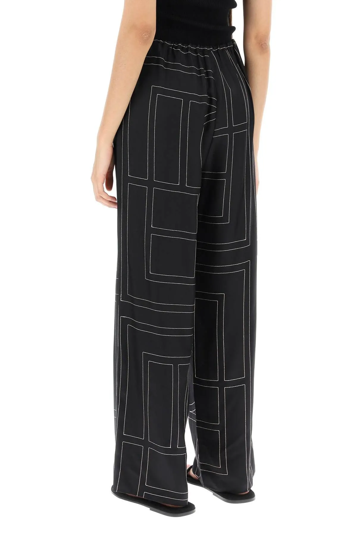 Pantaloni in seta ricamo monogram