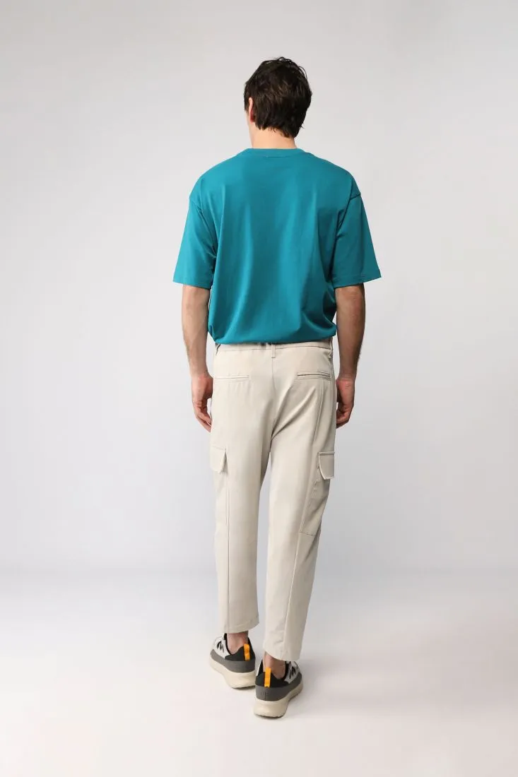 Pantaloni slim-fit monocolour con tasche laterali applicate